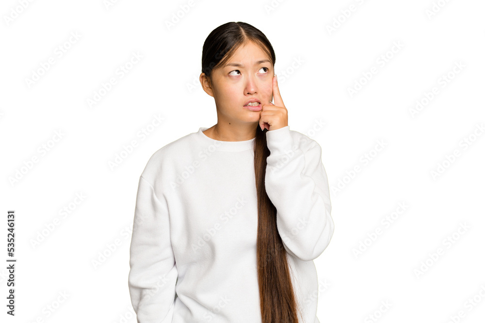 Young Asian woman isolated on green chroma background crying, unhappy with something, agony and confusion concept. Young Asian woman isolated on green chroma background crying, unhappy with something, agony and confusion concept.