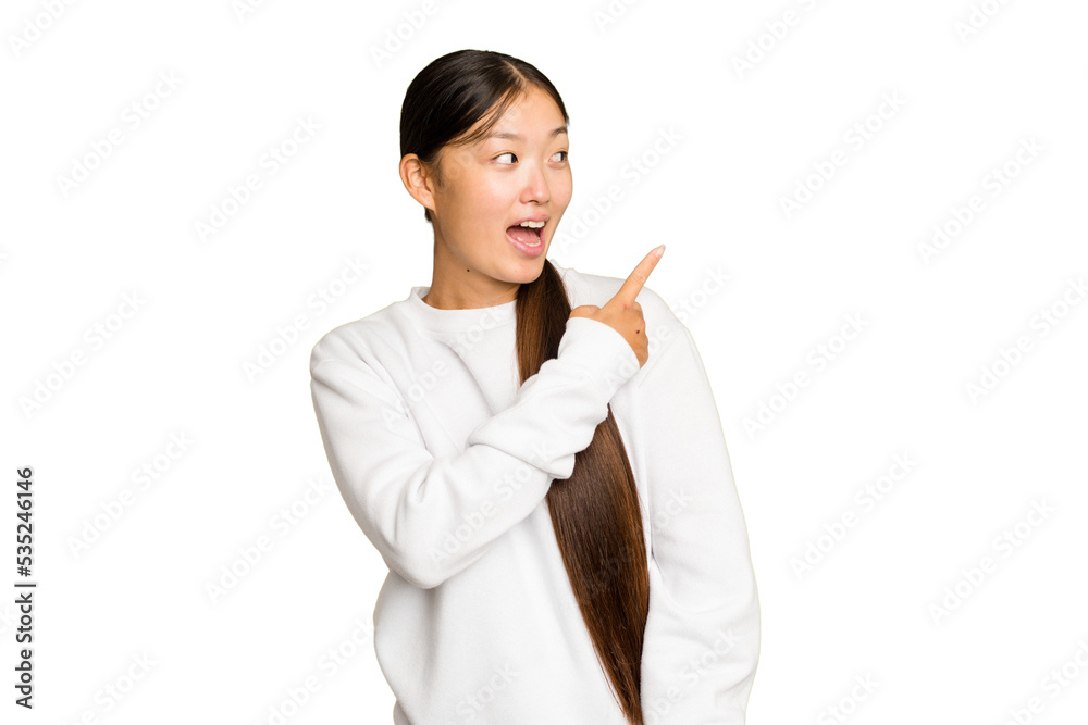 Young Asian woman isolated on green chroma background looks aside smiling, cheerful and pleasant. Young Asian woman isolated on green chroma background looks aside smiling, cheerful and pleasant.