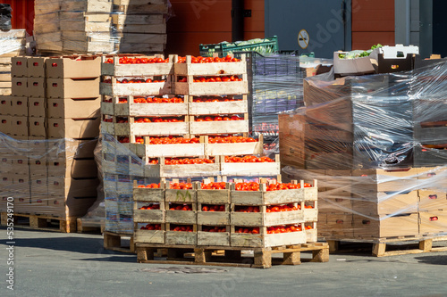 boxes of tomatoes in front of the food warehouse