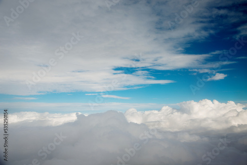 Fototapeta Naklejka Na Ścianę i Meble -  Above clouds from airplane window