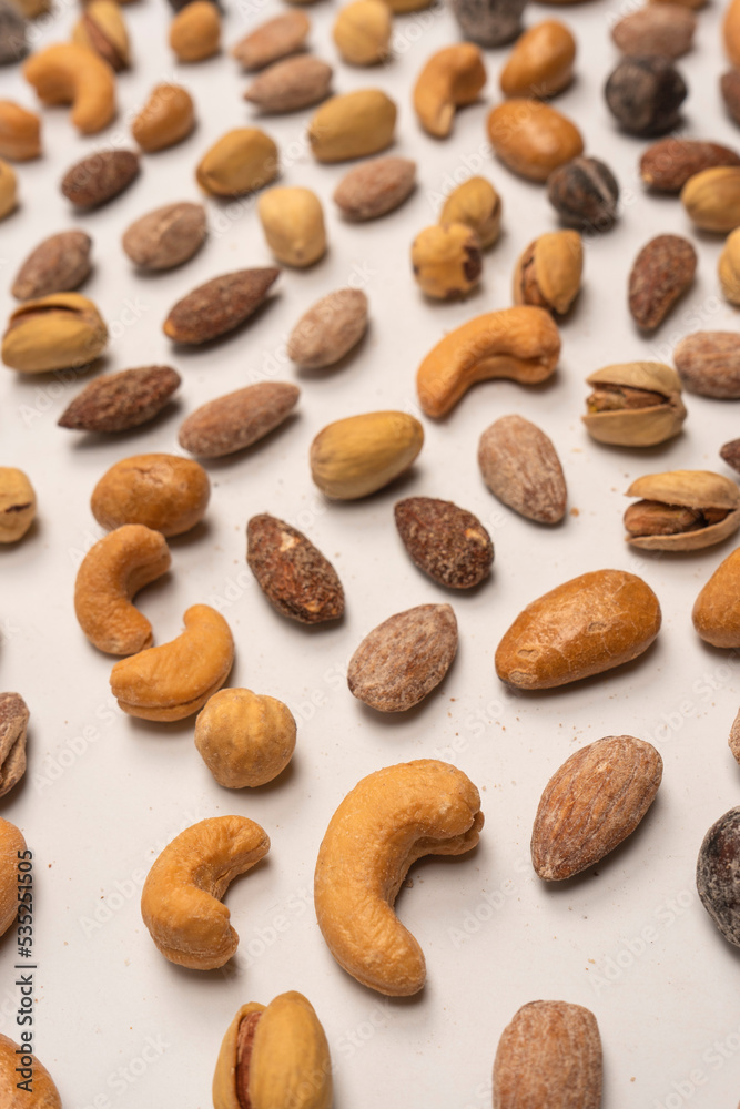 A group of almonds, pistachios, walnuts, macadamia, cashews. A group of almonds, pistachios, walnuts, macadamia, cashews.