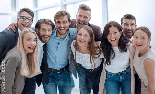 close up. group of smiling young people looking at the camera . © ASDF