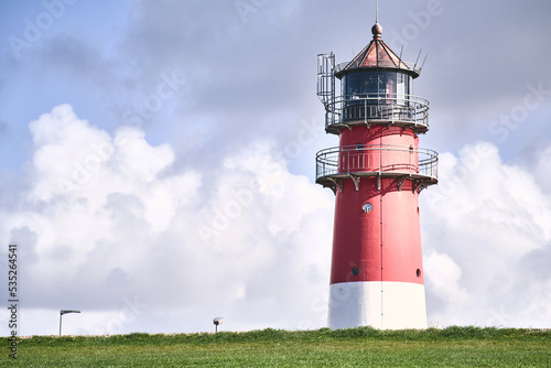 Lighthouse behind a dike in nothern Germany. High quality photo