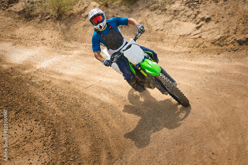 Motocross rider taking a curve.