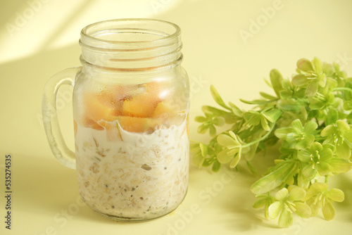 Breakfast overnight oats with fresh mango in a jar