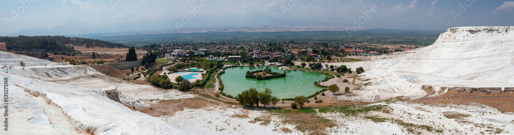 Pamukkale landsape panoramic view. White terraces with natural travertines in Pamukkale. Amazing scenery of calcium mountains in Turkey