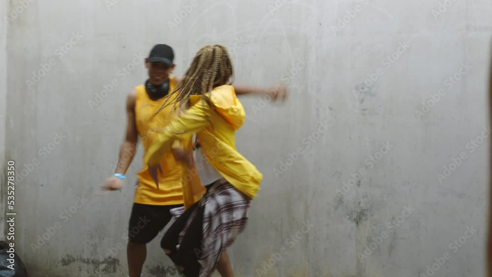 Dance, hip hop and phone filming of crazy dancers for social media, web and internet video. People with energy using technology and 5g internet to record a dancing man and woman for a digital vlog Dance, hip hop and phone filming of crazy dancers for social media, web and internet video. People with energy using technology and 5g internet to record a dancing man and woman for a digital vlog