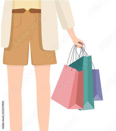  Woman with shopping bags in their hands during the sale or discount. Black Friday sale. 
