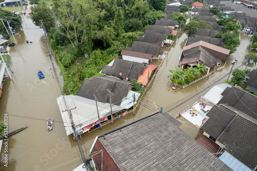 High-angle view of the Great Flood, Meng District, Thailand, on October 3, 2022, is a photograph from real flooding. With a slight color adjustment
