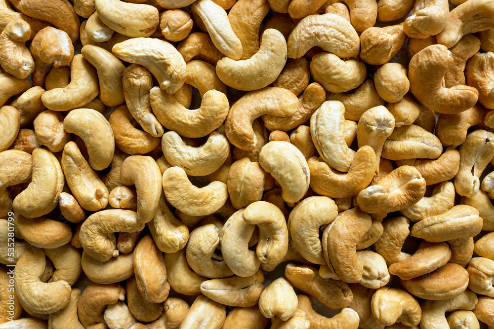Cashew nut close-up. A full-fledged source of vegetable protein for vegetarianism and raw food. Concept is healthy eating. Cashew nut close-up. A full-fledged source of vegetable protein for vegetarianism and raw food. Concept is healthy eating.