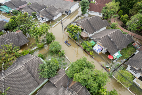 High-angle view of the Great Flood, Meng District, Thailand, on October 3, 2022, is a photograph from real flooding. With a slight color adjustment

