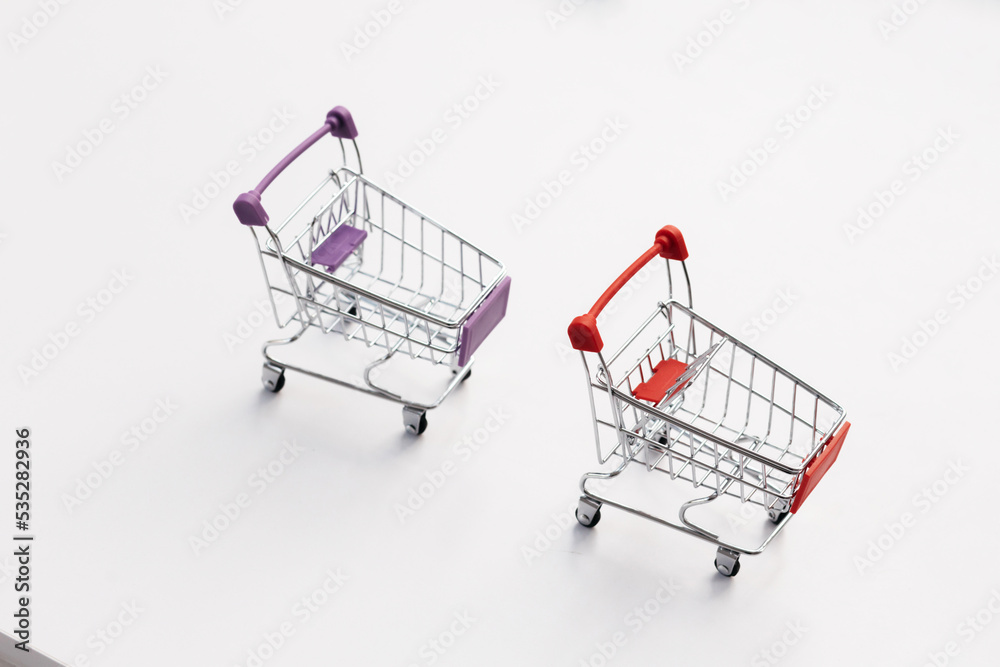 Empty top view mini shopping cart or trolley shopping on white background, concept shopping in supermarket.
