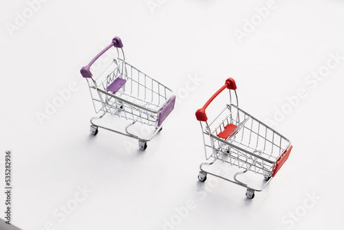 Empty top view mini shopping cart or trolley shopping on white background, concept shopping in supermarket.