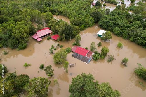 High-angle view of the Great Flood, Meng District, Thailand, on October 3, 2022, is a photograph from real flooding. With a slight color adjustment
