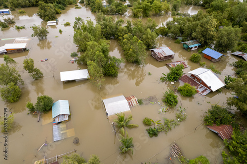 High-angle view of the Great Flood, Meng District, Thailand, on October 3, 2022, is a photograph from real flooding. With a slight color adjustment
