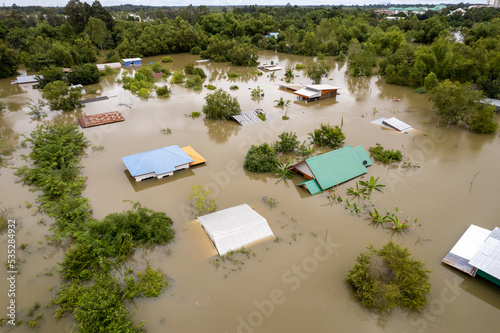 High-angle view of the Great Flood, Meng District, Thailand, on October 3, 2022, is a photograph from real flooding. With a slight color adjustment
