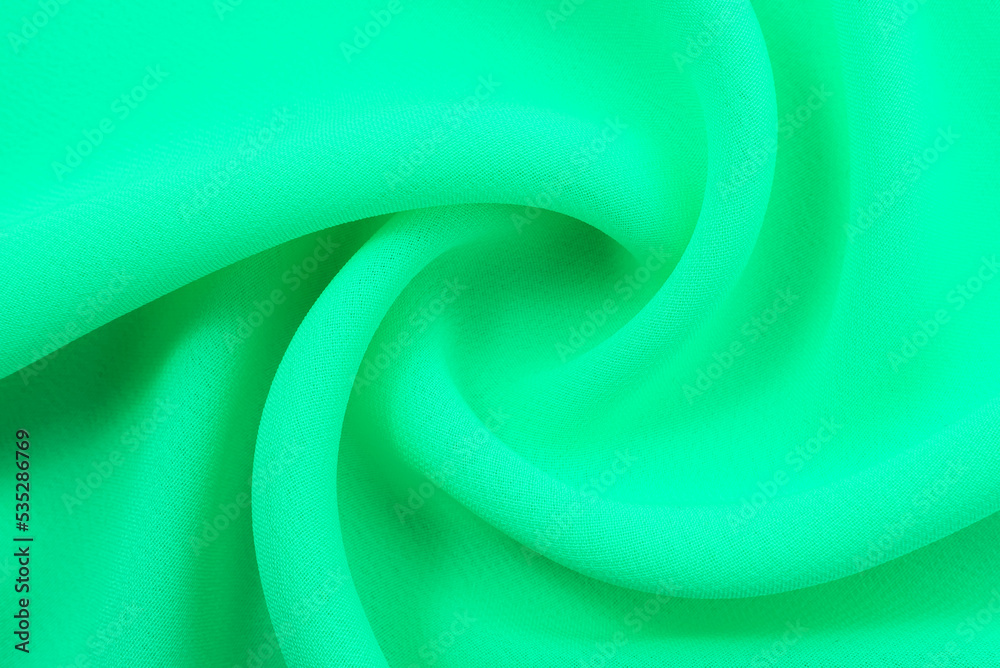 Fabric chintz, satin, green silk with folds and wrinkling. Aquamarine fabric texture Fabric chintz, satin, green silk with folds and wrinkling. Aquamarine fabric texture
