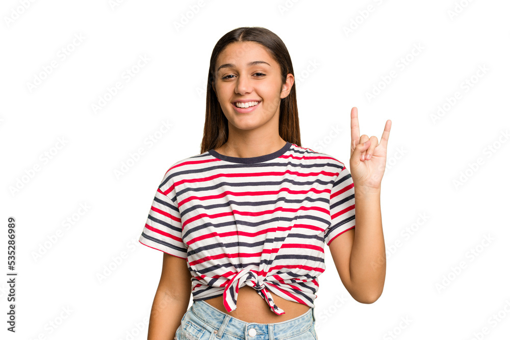 Young Indian woman isolated cutout removal background showing a horns gesture as a revolution concept. Young Indian woman isolated cutout removal background showing a horns gesture as a revolution concept.