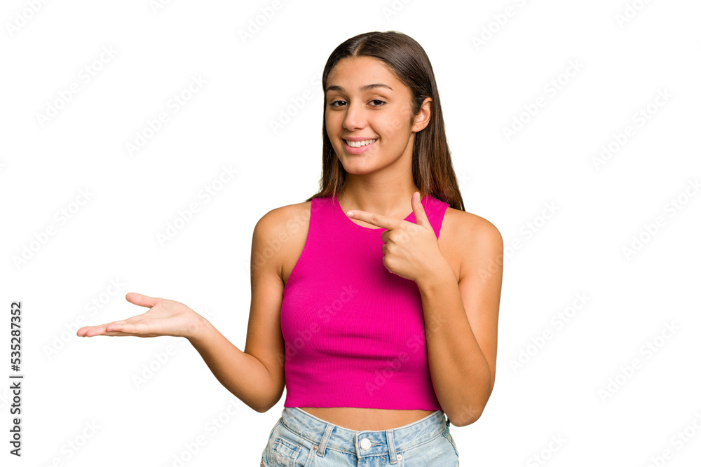 Young Indian woman isolated cutout removal background excited holding a copy space on palm. Young Indian woman isolated cutout removal background excited holding a copy space on palm.