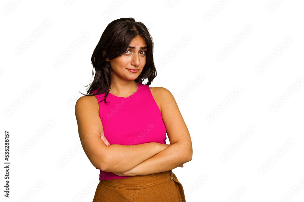 Young Indian woman isolated on green chroma background suspicious, uncertain, examining you. Young Indian woman isolated on green chroma background suspicious, uncertain, examining you.