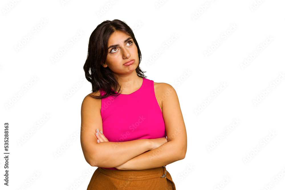 Young Indian woman isolated on green chroma background tired of a repetitive task. Young Indian woman isolated on green chroma background tired of a repetitive task.
