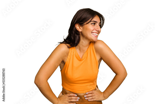 Young Indian woman isolated on green chroma background confident keeping hands on hips.