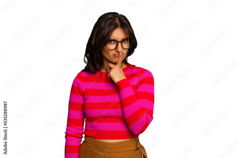 Young Indian woman isolated on green chroma background thinking and looking up, being reflective, contemplating, having a fantasy. Young Indian woman isolated on green chroma background thinking and looking up, being reflective, contemplating, having a fantasy.