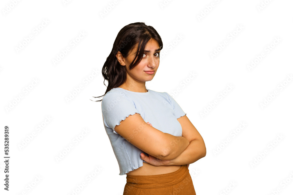 Young Indian woman isolated on green chroma background suspicious, uncertain, examining you. Young Indian woman isolated on green chroma background suspicious, uncertain, examining you.