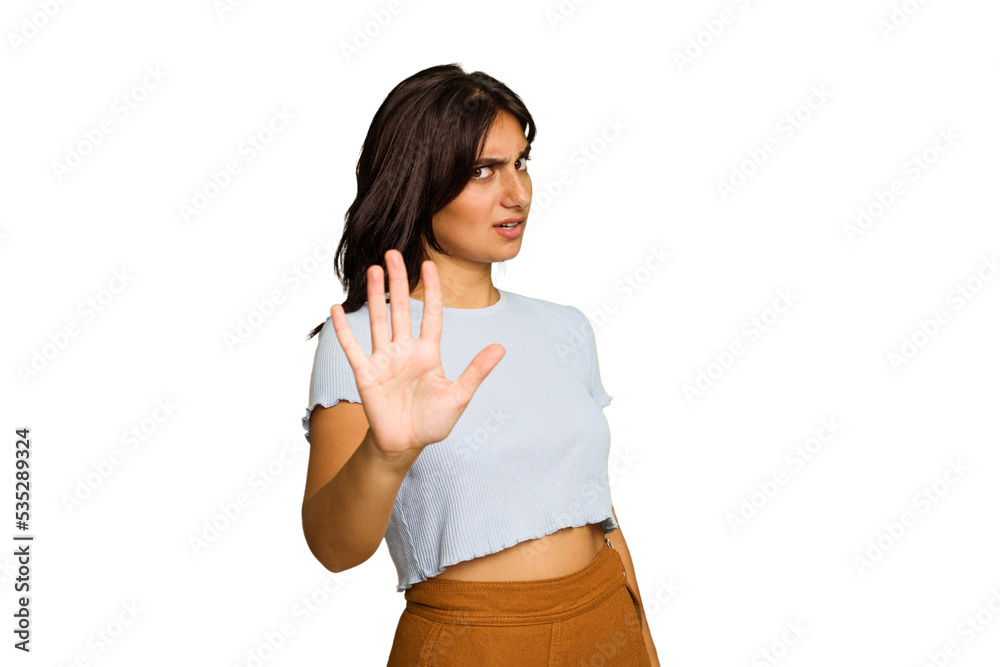 Young Indian woman isolated on green chroma background rejecting someone showing a gesture of disgust.