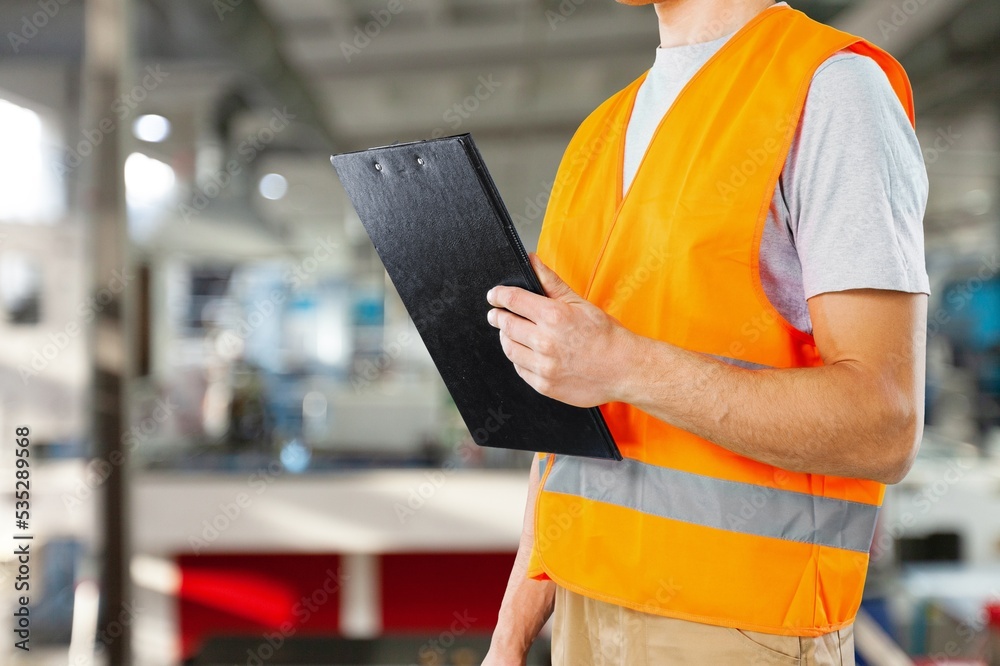 Young factory worker work with Industrial technology and manufacturing Young factory worker work with Industrial technology and manufacturing