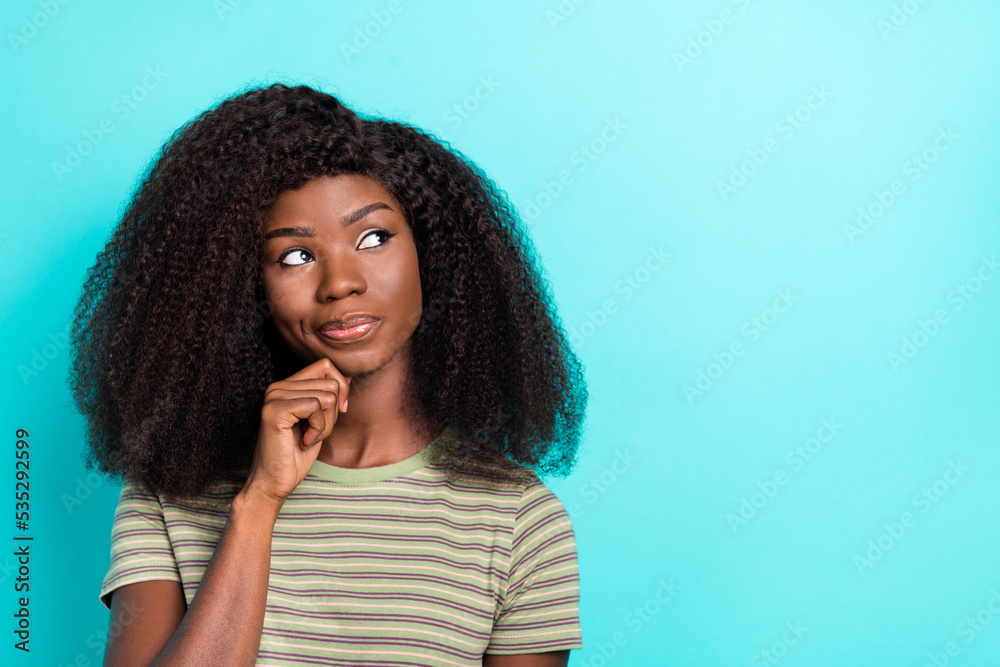 Photo of cute thoughtful girl dressed green t-shirt arm chin looking empty space isolated teal color background Photo of cute thoughtful girl dressed green t-shirt arm chin looking empty space isolated teal color background
