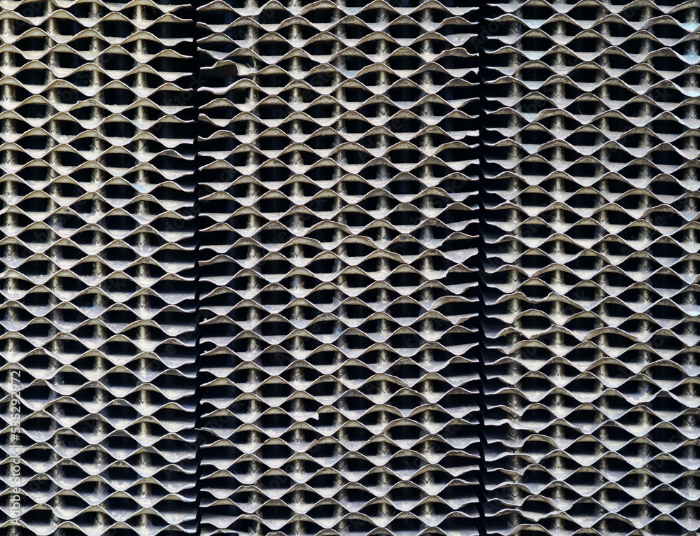 Syllabic radiator grille of an old agricultural tractor Syllabic radiator grille of an old agricultural tractor
