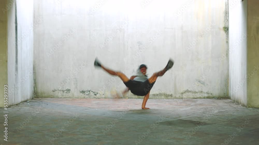 Fitness, hip hop and breakdance athlete man stunt practice for exercise and technique rehearsal. Urban dancer workout training for improvisation, individuality and passion for dance performance. Fitness, hip hop and breakdance athlete man stunt practice for exercise and technique rehearsal. Urban dancer workout training for improvisation, individuality and passion for dance performance.