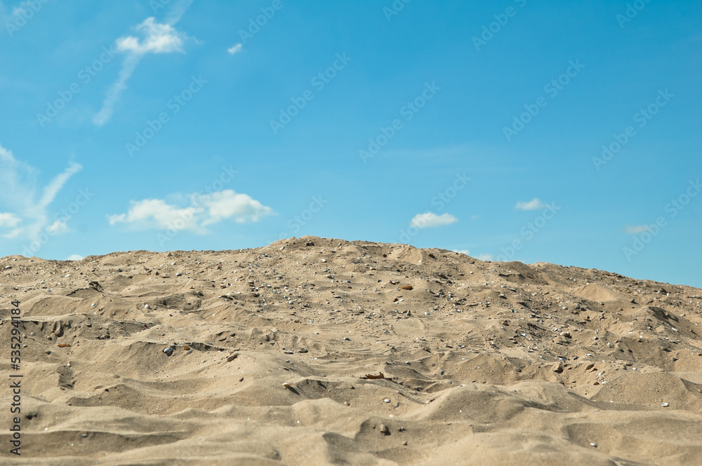 sand and blue sky, in the photo sand mountain blue sky and clouds