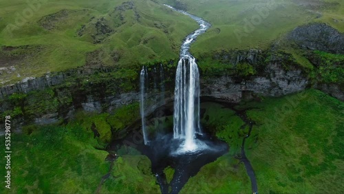 aerial view drone of Seljalandsfoss waterfall tourist attaction iceland landmark wide high shot photo