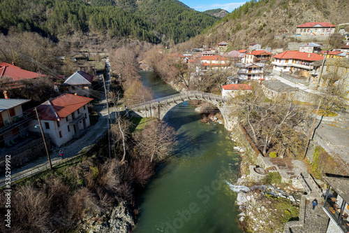Aerial view of  Vovousa village and aoos river  located next to Valia Calda pindus national Park on east Zagori, Epirus, Greece. photo