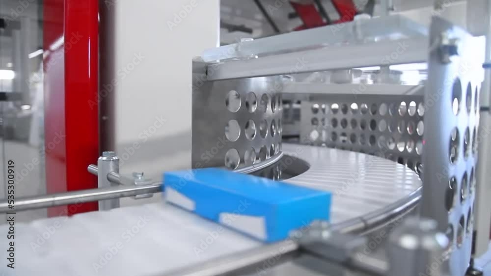 Robotic machine, products in boxes. Robotic machine, products in boxes.
