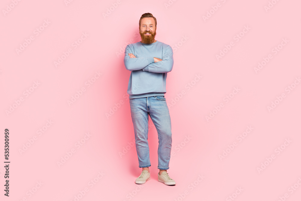 Full size portrait of satisfied glad young man crossed arms toothy smile isolated on pink color background Full size portrait of satisfied glad young man crossed arms toothy smile isolated on pink color background