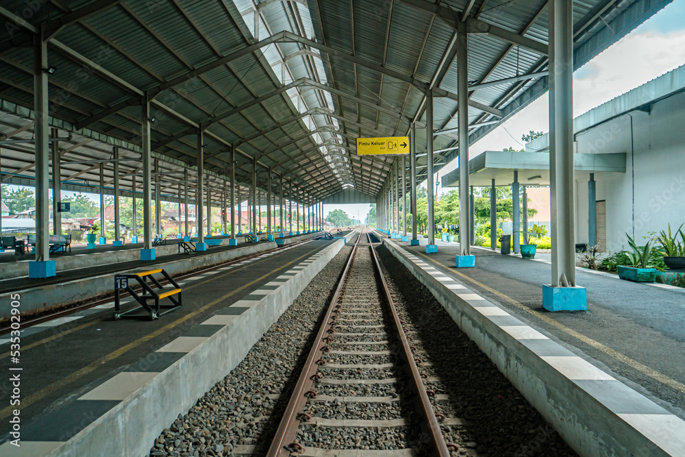 Train station which is still very empty of passengers due to the effects of the covid 19 pandemic, the station looks a little bit crowded at peak hour