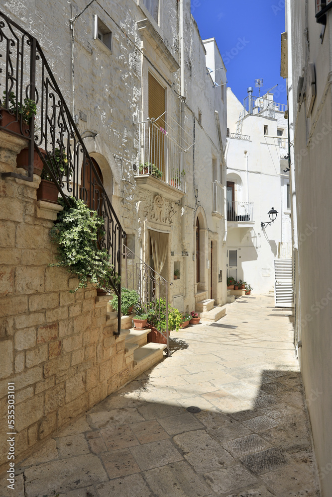 Obraz premium Historic district of Locorotondo. Locorotondo is an Italian municipality of about 14000 inhabitants (as of December 31, 2019) in the metropolitan city of Bari, Apulia region.