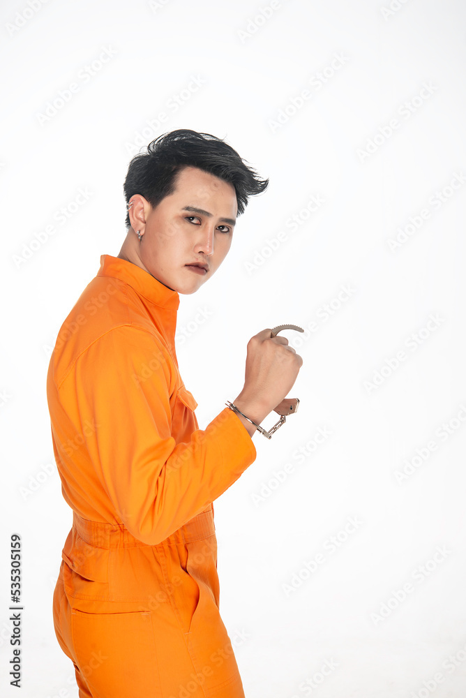 Portrait of prisoner on white background,Asian bad guy,The criminal was arrested by the police. Portrait of prisoner on white background,Asian bad guy,The criminal was arrested by the police.