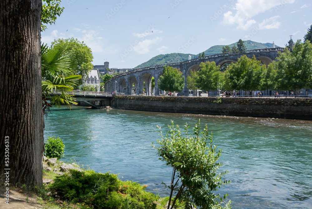 View of the river Gave de Pau in Lourdes, France.