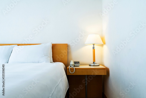 Telephone on the bedside in bedroom