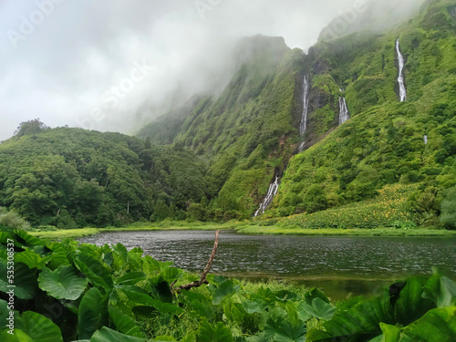 View of tropical waterfalls and lake at pozo da alagoinha at flores island at Azores, portugal.
 photo