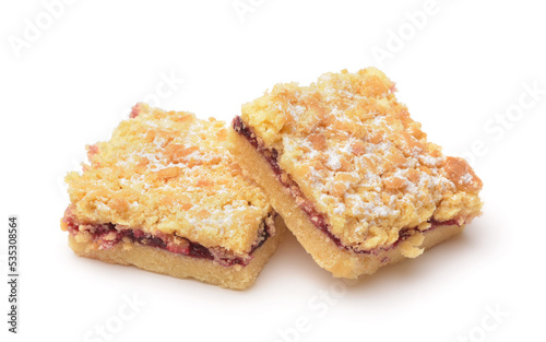 Two pieces of crumb cake with fruit jam