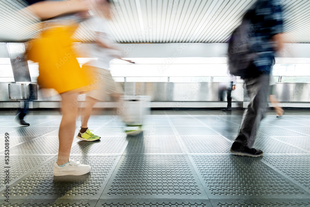 Fototapeta premium Tourist with suitcase walking on footbridge