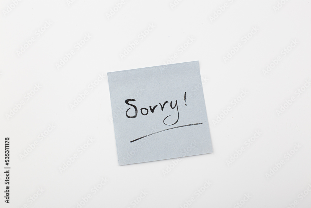 Sorry handwriting text isolated. Writing text on memo post reminder. Sorry handwriting text isolated. Writing text on memo post reminder.