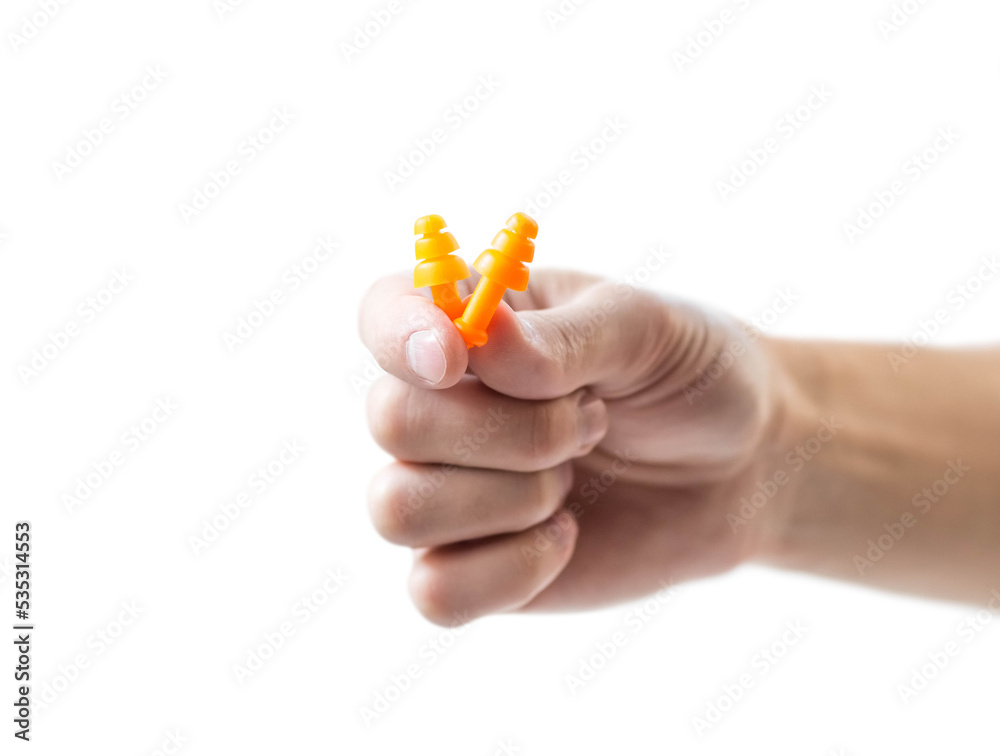 The hand holds bright earplugs on a white background The hand holds bright earplugs on a white background