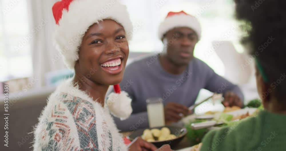 Portrait of happy african american family having christmas dinner Portrait of happy african american family having christmas dinner