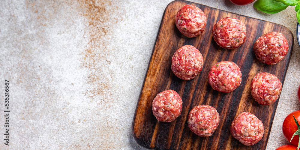 raw meat balls ground meat ground fresh pork, beef, lamb cooking healthy meal food snack diet on the table copy space food background rustic top view raw meat balls ground meat ground fresh pork, beef, lamb cooking healthy meal food snack diet on the table copy space food background rustic top view
